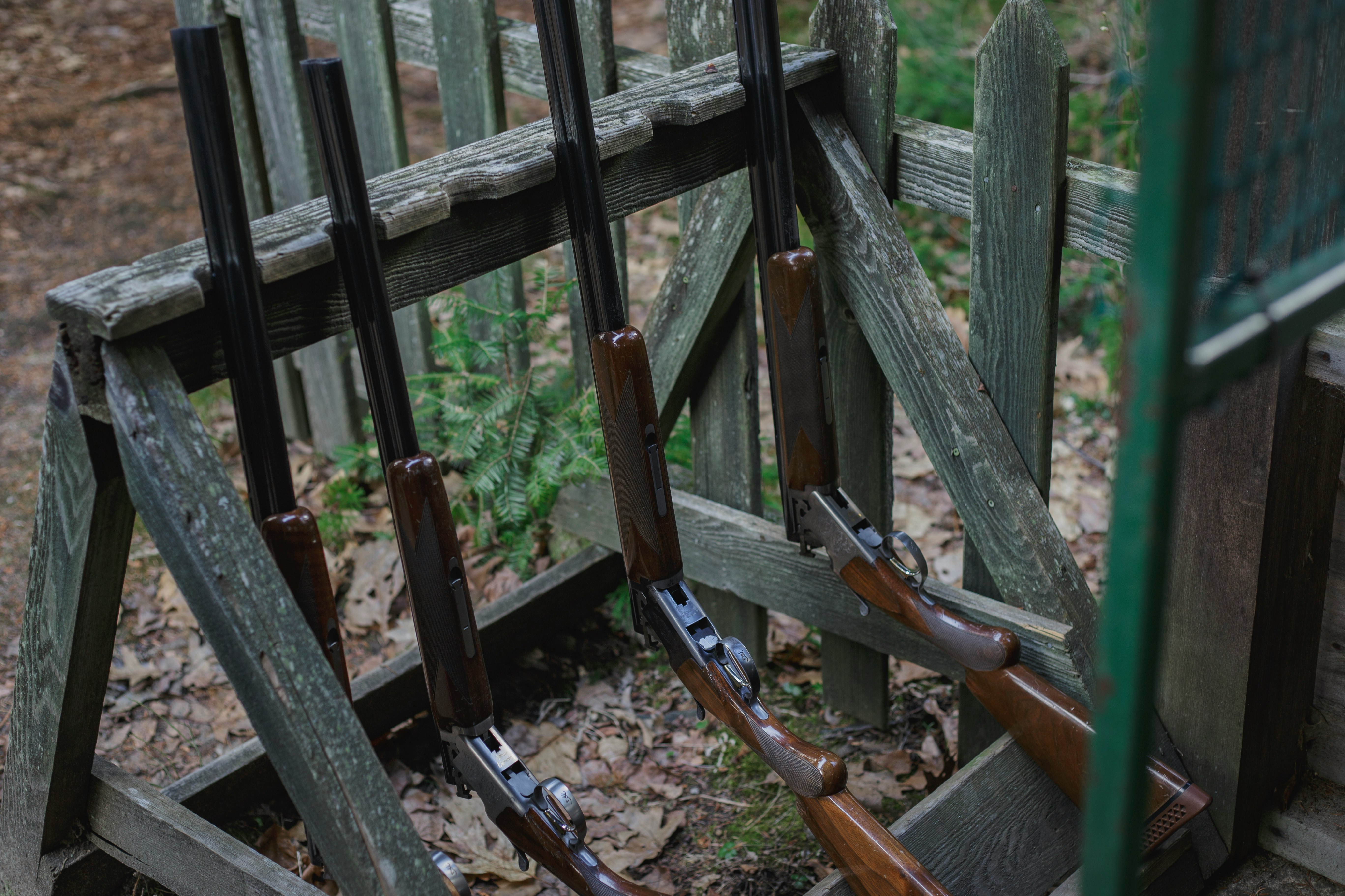 rifles on wooden stand